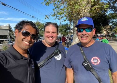 Senator Vin Gopal with two local firefighters.